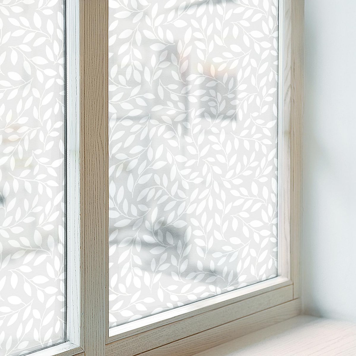 Folia okienna dekoracyjna - Subtelne liście na szarym tle