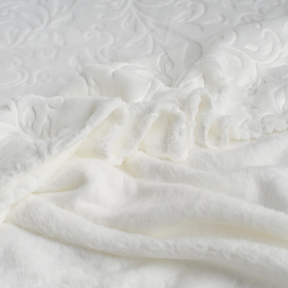 Jednokolorowy koc z wytłoczonym wzorem Conosinos 150x200 cm z motywem arabeski