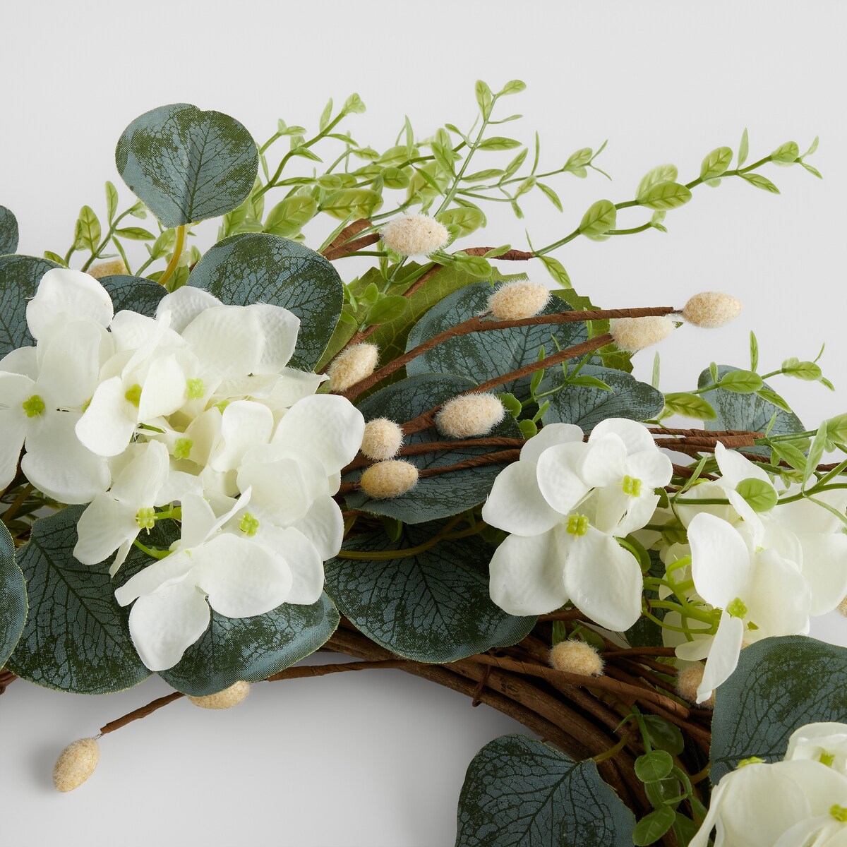 Wianek Motheosi z motywem kwiatowym i baziami