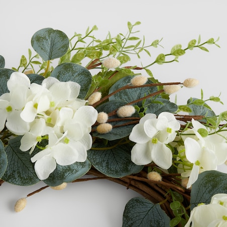 Wianek Motheosi z motywem kwiatowym i baziami