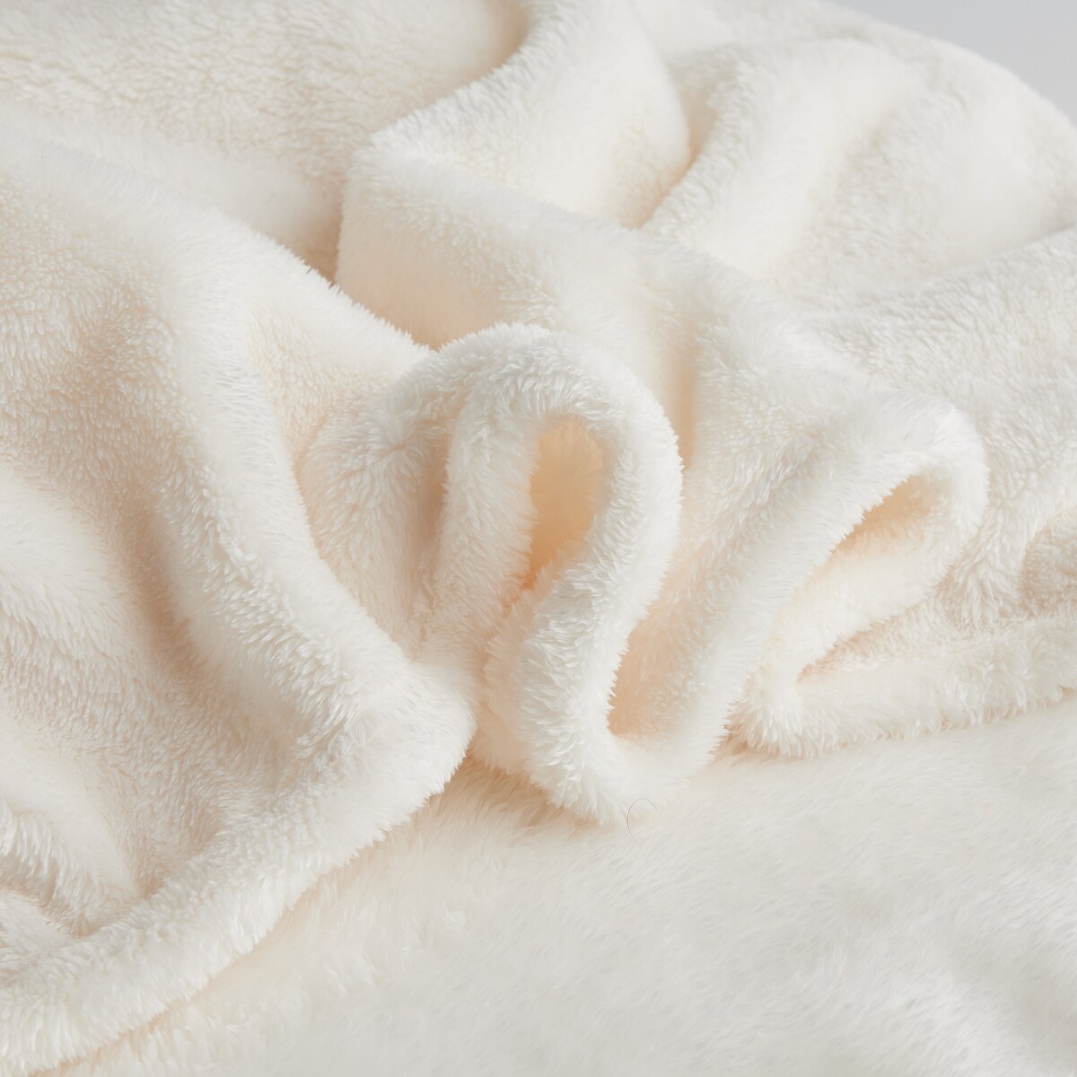 Jednokolorowy koc z pomponami Ponnie 150x200 cm