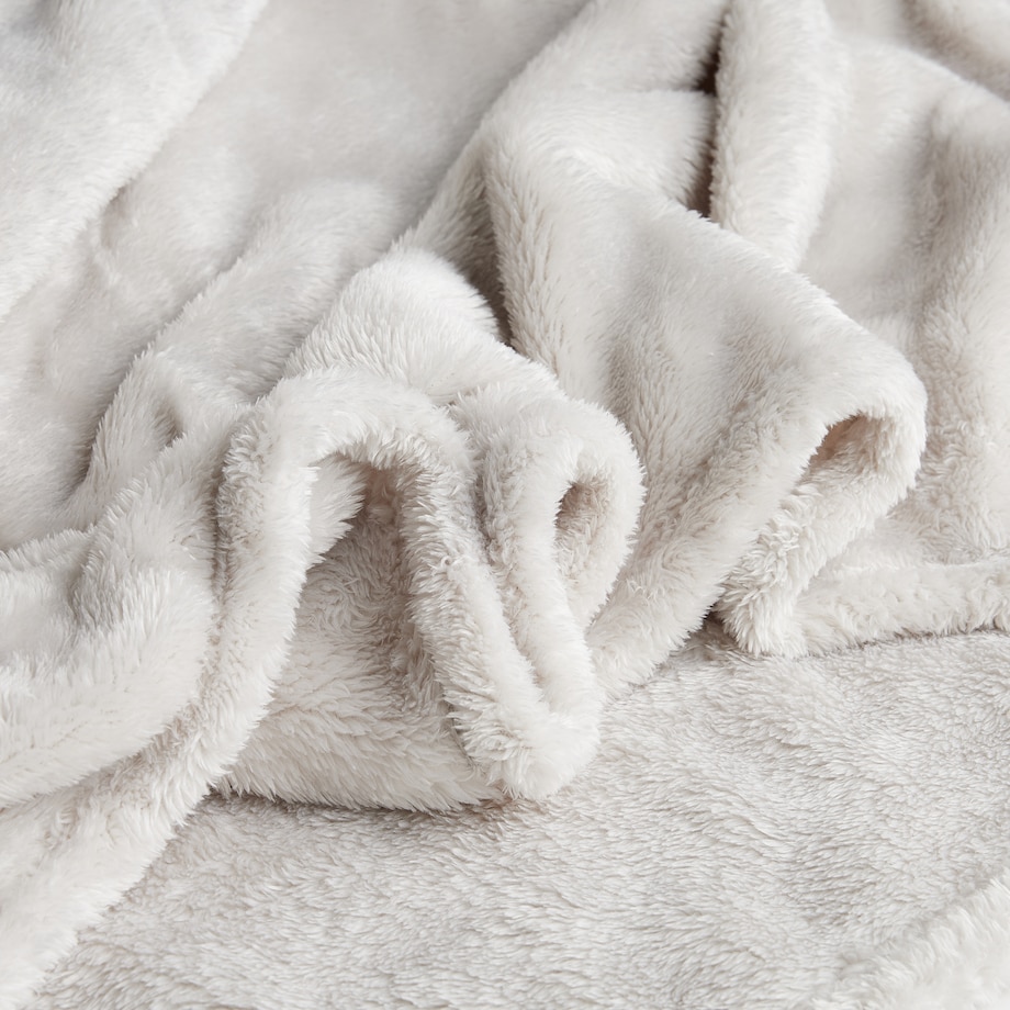 Jednokolorowy koc z pomponami Ponnie 150x200 cm