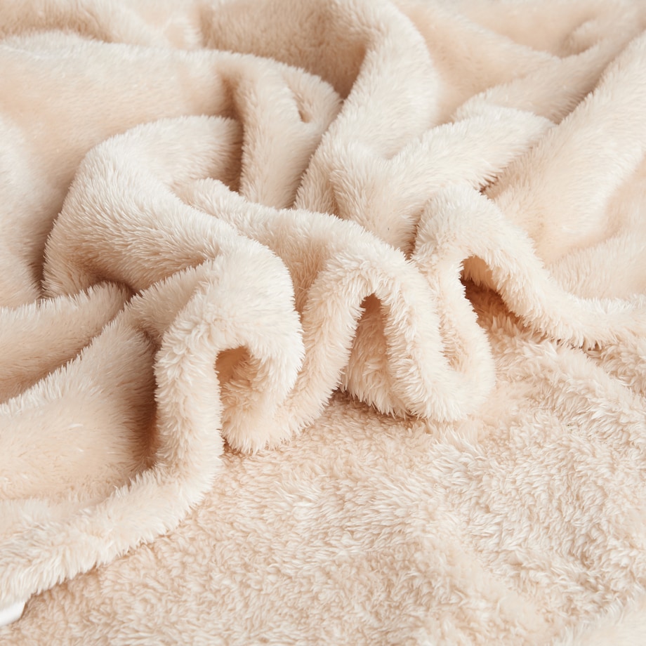 Jednokolorowy koc z pomponami Ponnie 150x200 cm