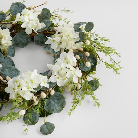 Wianek Motheosi z motywem kwiatowym i baziami