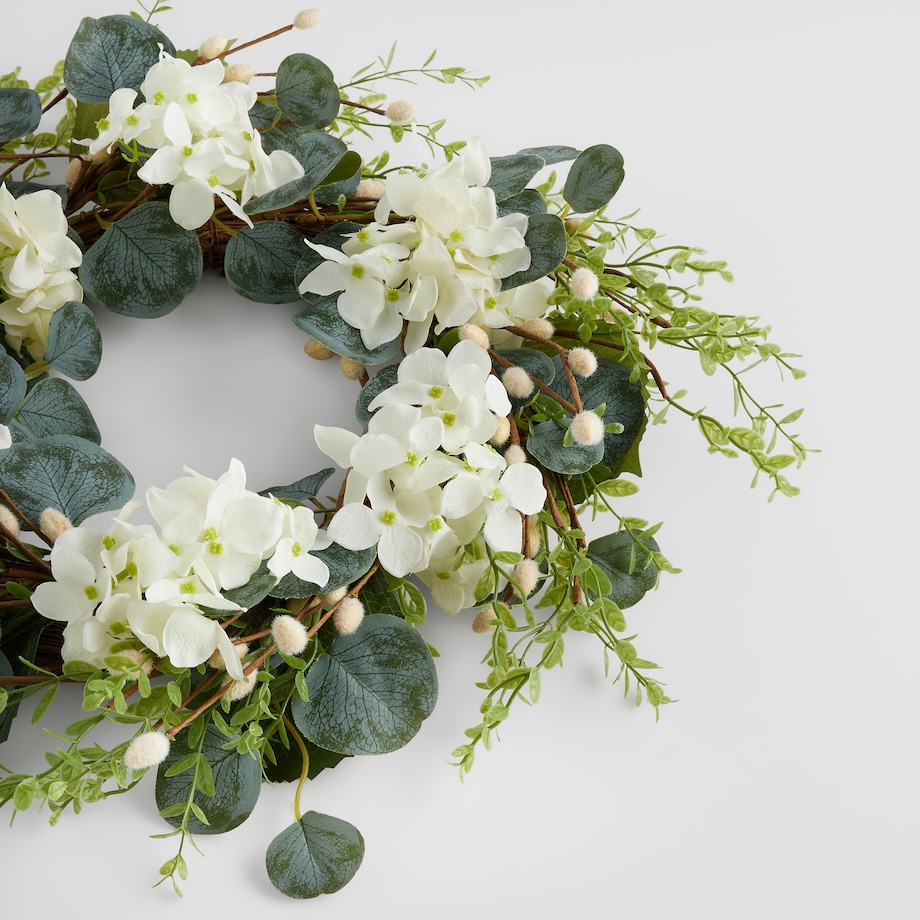 Wianek Motheosi z motywem kwiatowym i baziami