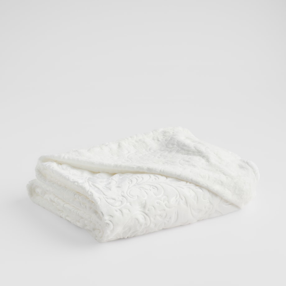 Jednokolorowy koc z wytłoczonym wzorem Conosinos 150x200 cm z motywem arabeski