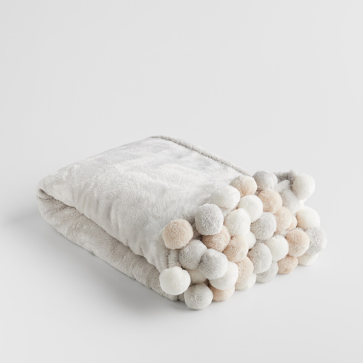 Jednokolorowy koc z pomponami Ponnie 150x200 cm