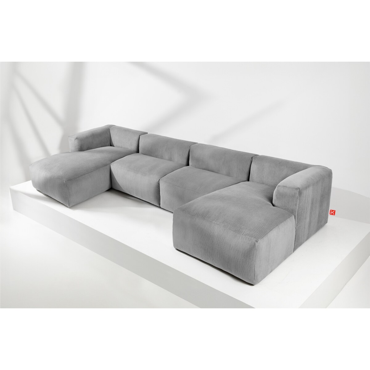 KONSIMO BUFFO 7/8-osobowa panoramiczna sofa narożna z wyjątkowo miękkim siedziskiem, kolor jasny szary