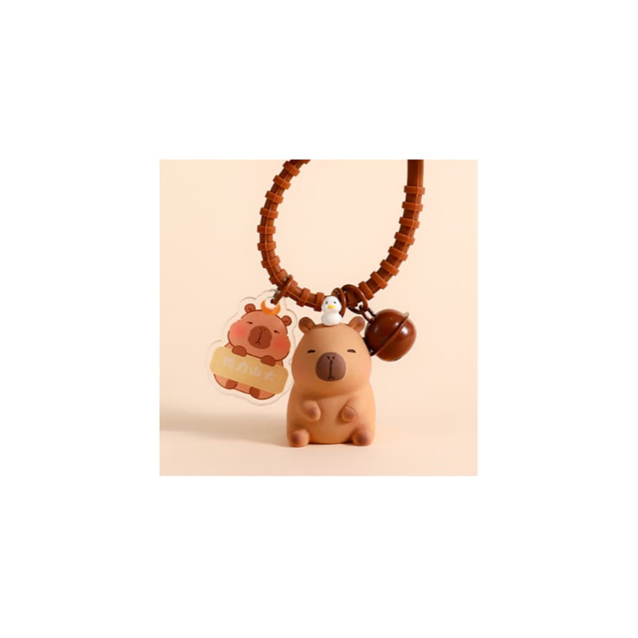 Brelok do kluczy Kapibara 4x 2,5 cm z ptaszkiem, przywieszką i dzwoneczkiem BRL338