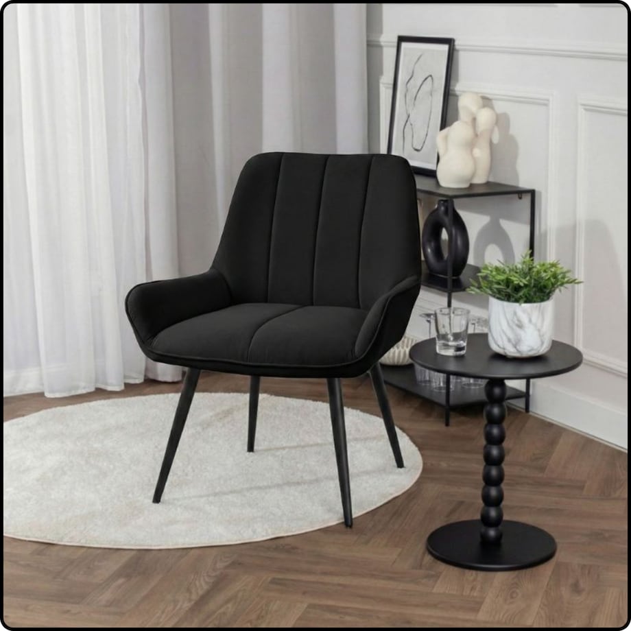 Fotel uszak tapicerowany welurowy wygodny z czarnymi nogami do salonu czarny