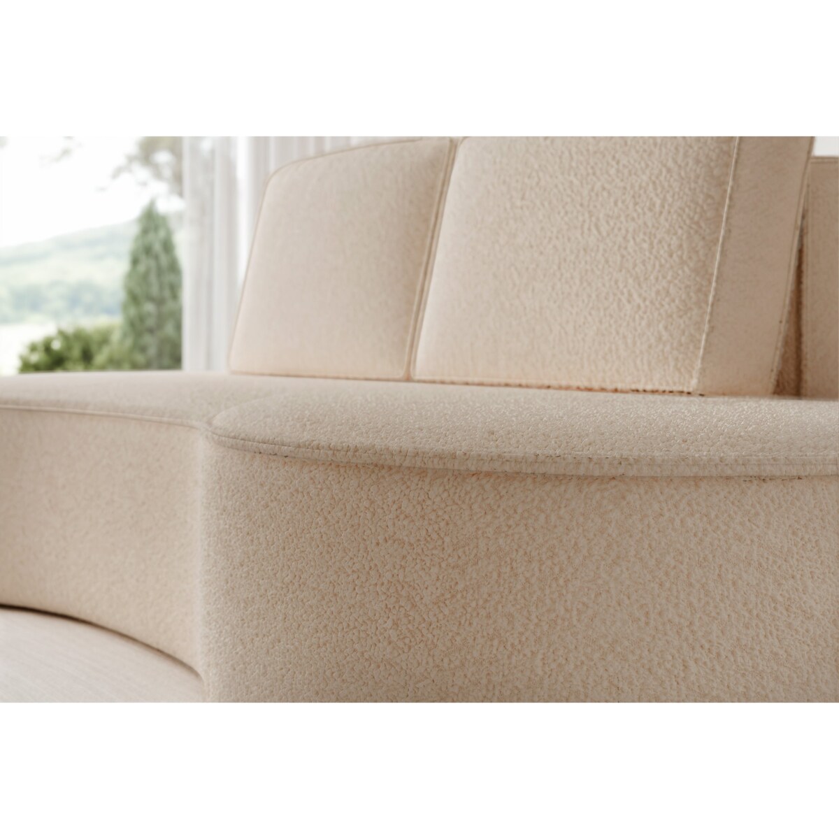 Beżowa sofa tapicerowana do salonu SOFIA o zaokrąglonych bokach - boucle