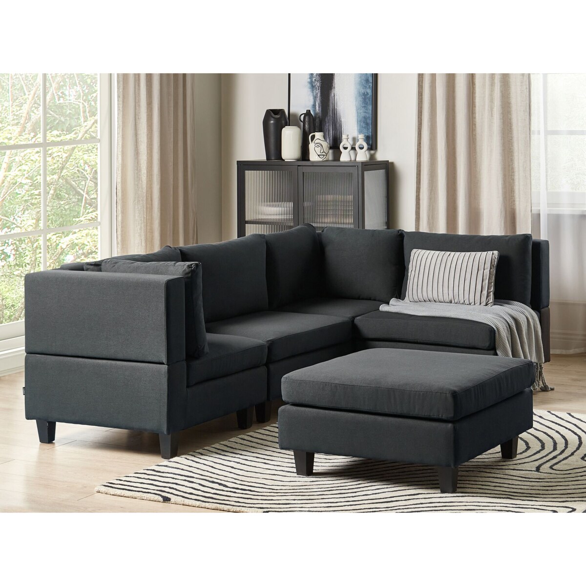 Tapicerowany lewostronny narożnik modułowy 4-osobowy z otomaną czarny UNSTAD