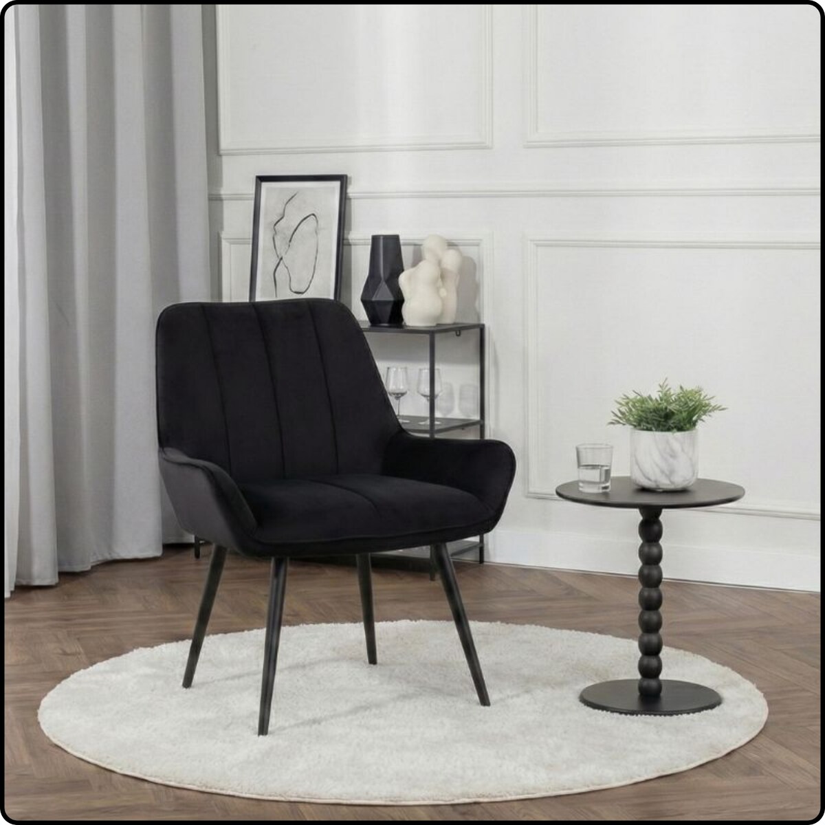 Fotel uszak tapicerowany welurowy wygodny z czarnymi nogami do salonu czarny