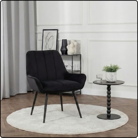 Fotel uszak tapicerowany welurowy wygodny z czarnymi nogami do salonu czarny
