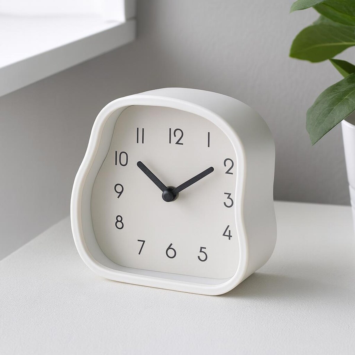 Zegar stołowy AMORPH o organicznym kształcie z przeszklonym frontem, 12 cm