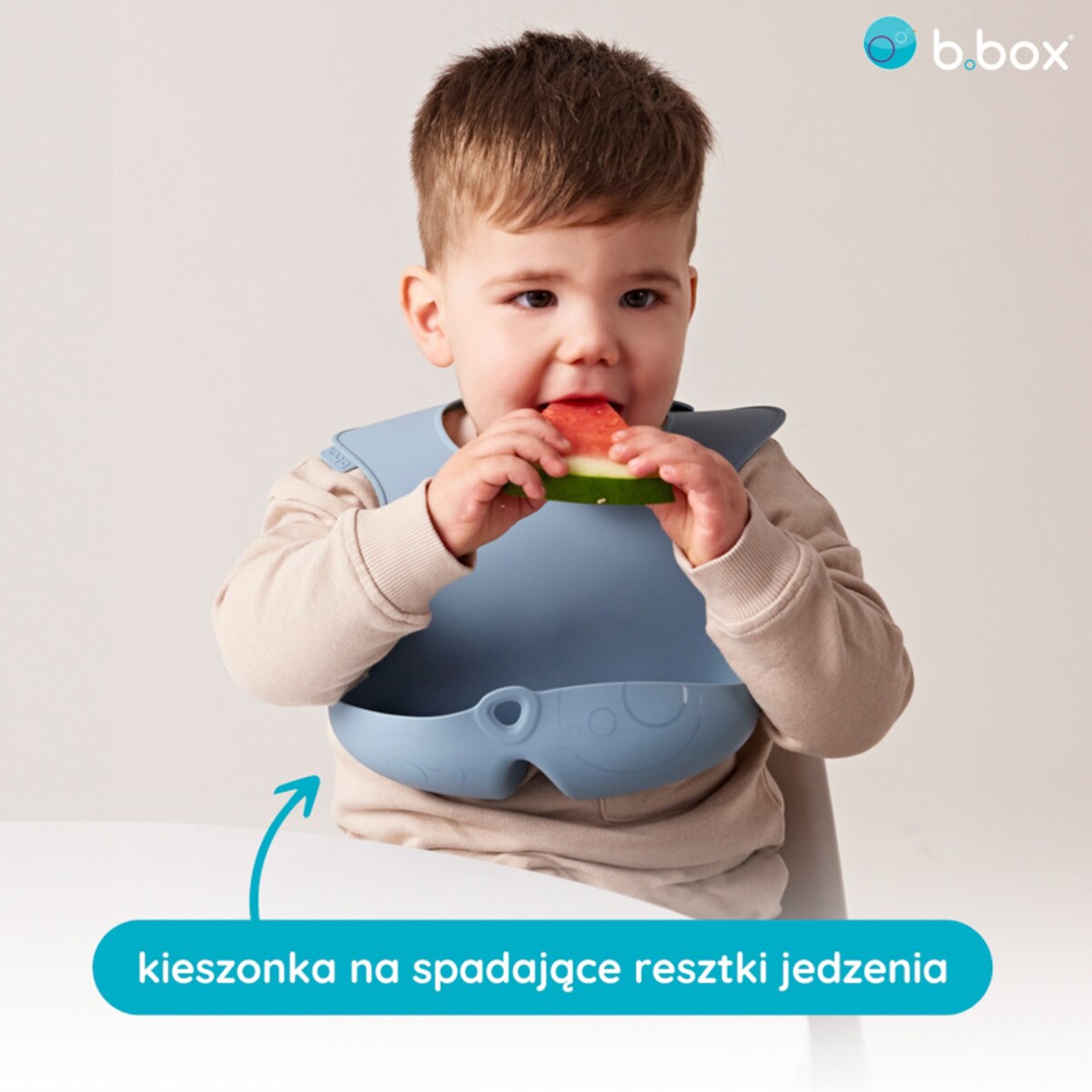 Śliniak silikonowy z kieszonką zwijany dla dziecka i niemowlaka niebieski, b.box