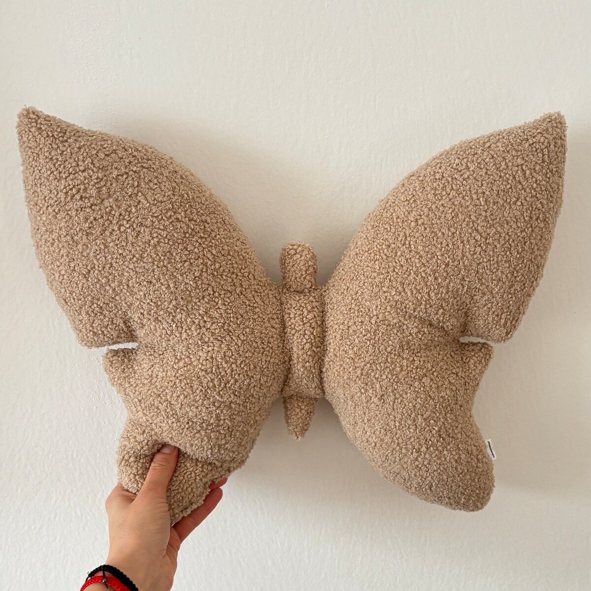 Poduszka dekoracyjna Motyl boucle beżowa