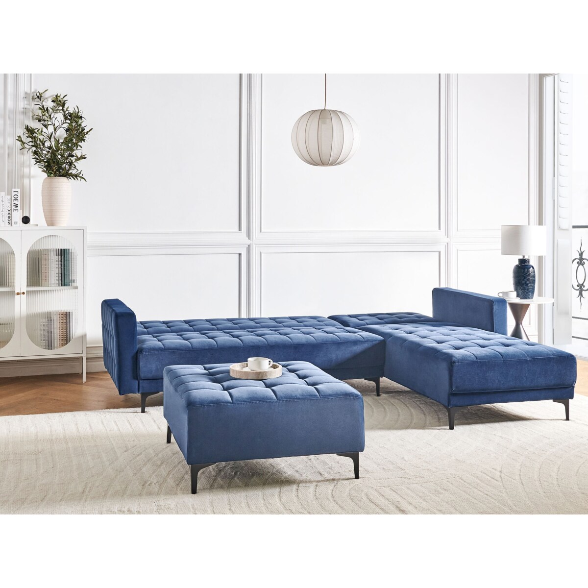 Sofa rozkładana lewostronna welurowa z otomaną niebieska ABERDEEN