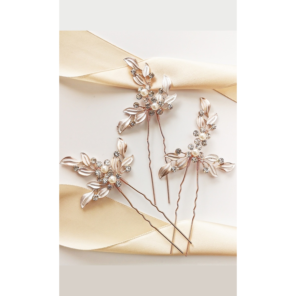 Zestaw wsuwek ślubnych z kwiatami i listkami rose gold