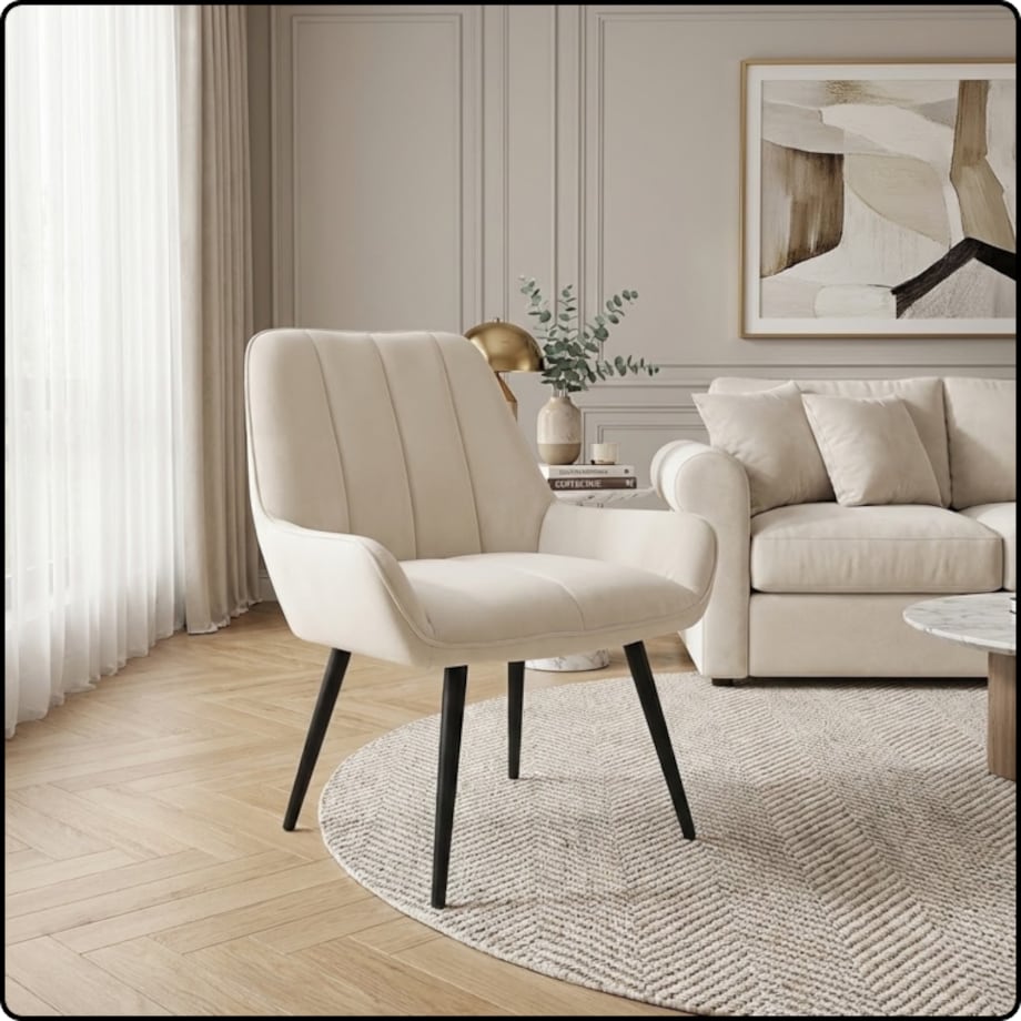 Fotel uszak tapicerowany welurowy wygodny z czarnymi nogami do salonu beżowy