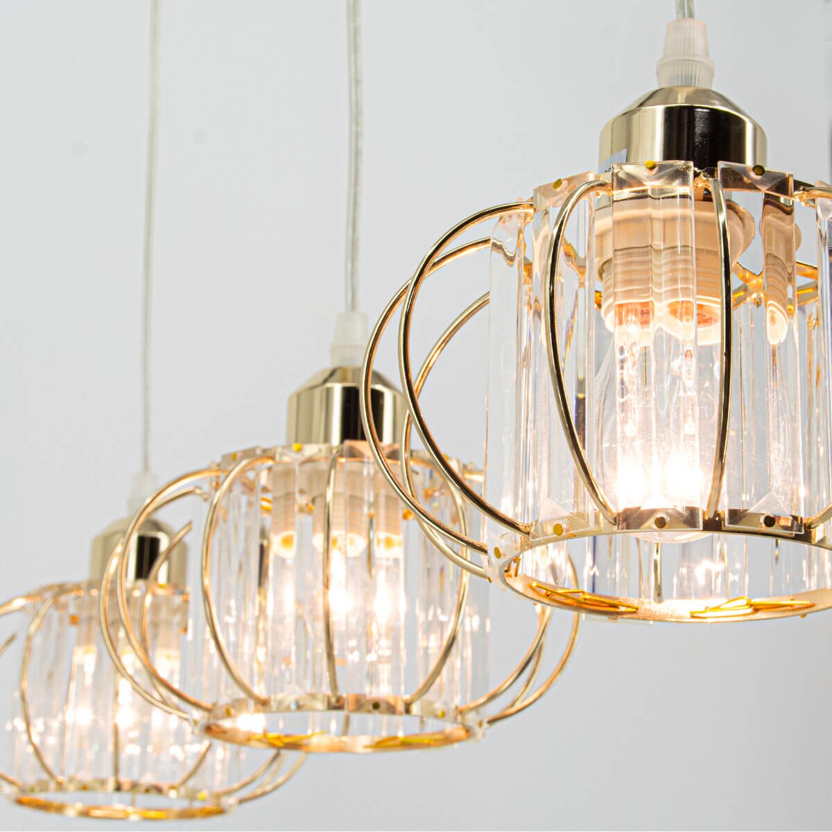 Skandynawska lampa zwieszana Acri 8221/3 TR potrójna nad stół szklana złota