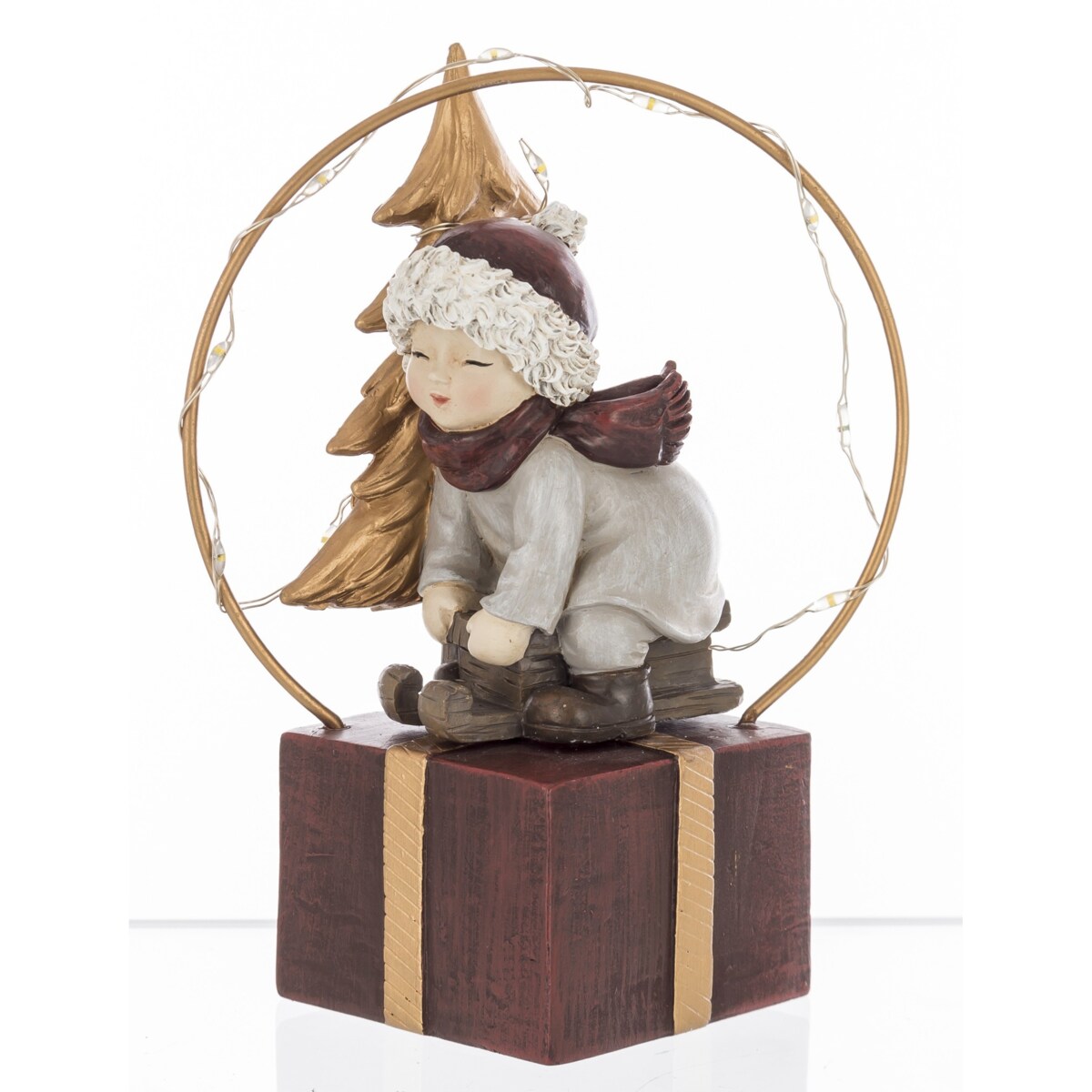 Dekoracja - chłopczyk na sankach na pudełku LED 13x7x8 cm