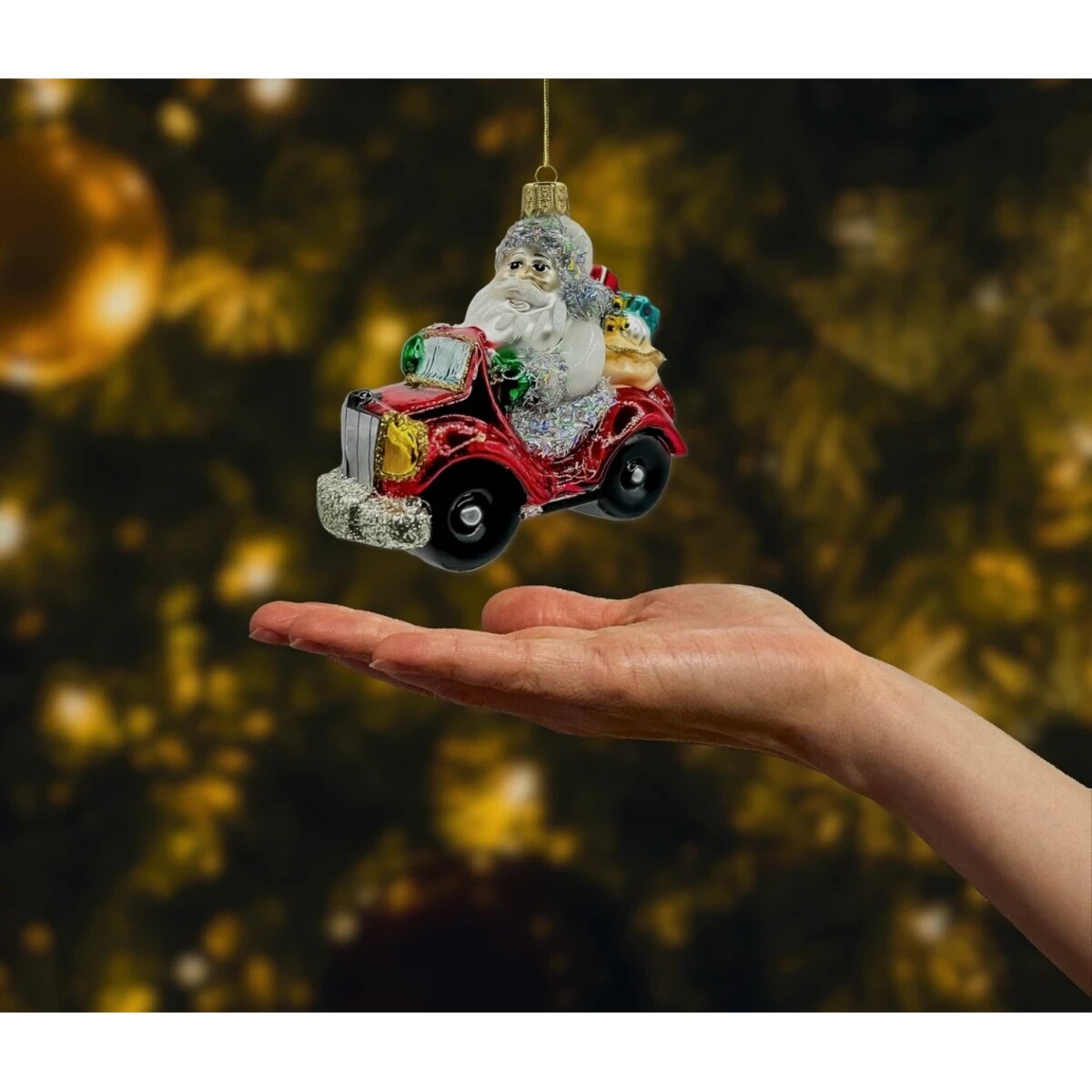 Bombka choinkowa: Święty Mikołaj w czerwonym samochodzie z prezentami