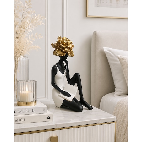 Figurka ceramiczna siedzącej kobiety 24,5x16,5x10,5 cm FIOR DORA-2 z książką i złotym kwiatem