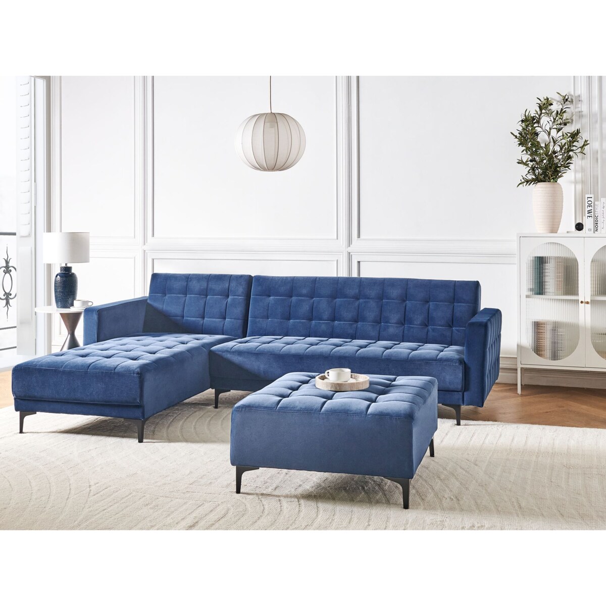 Sofa rozkładana prawostronna welurowa z otomaną niebieska ABERDEEN
