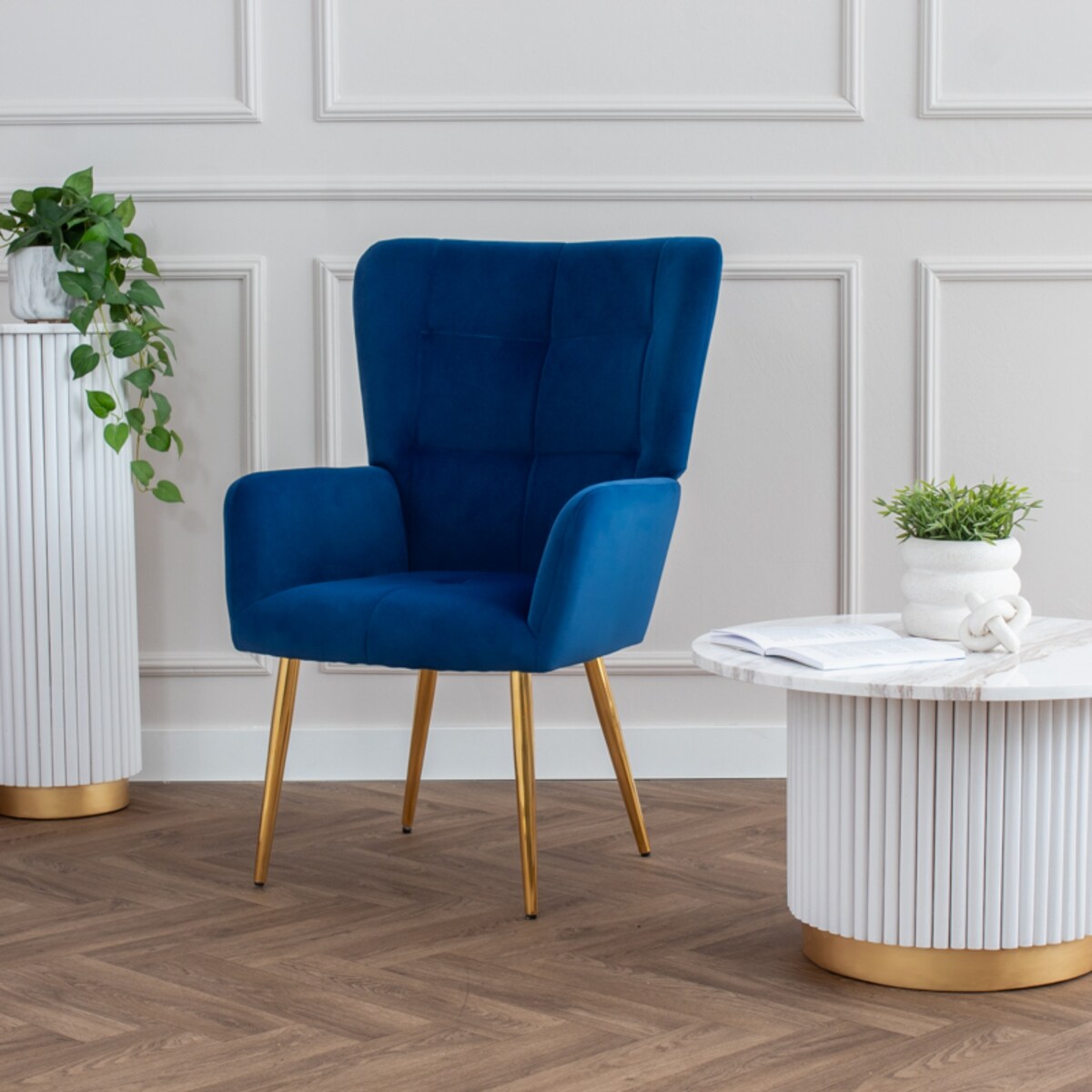 Fotel uszak do salonu wypoczynkowy welurowy tapicerowany granatowy złote nogi